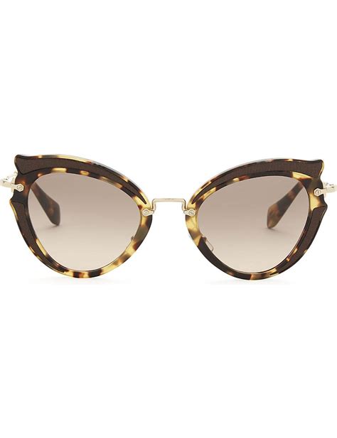 Miu Miu Sunglasses by Miuccia Prada .